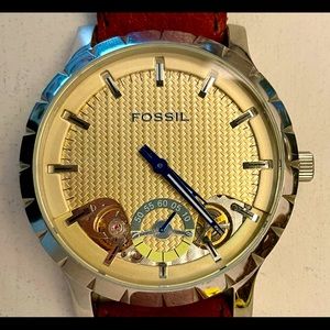 Fossil Mens watch. Gold color face with brown leather band.